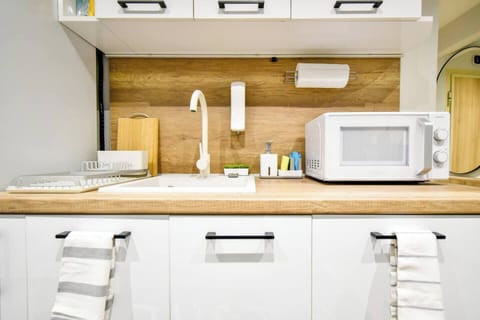 Our modern kitchen is perfect for culinary enthusiasts, equipped with everything from a stove top to a dishwasher. Message us for more kitchen details!