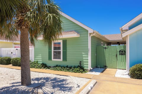 Colorful front exterior of property.