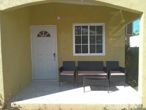 Front entrance with patio seating