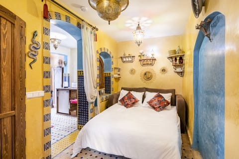 Comfortable double bed with fresh white linens for a restful stay