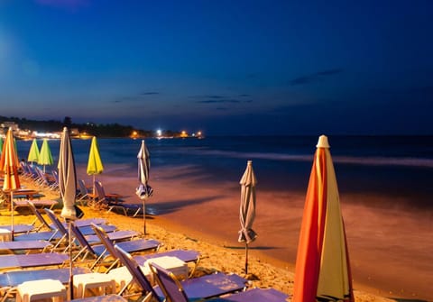 On the beach, sun loungers, beach umbrellas, beach bar