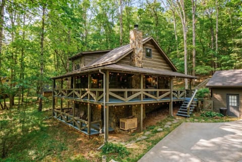 Your private wooded sanctuary. Unwind on the porch and listen to the sounds of nature surrounding this beautiful rustic retreat