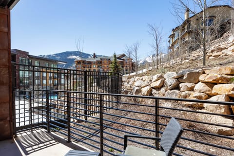- Gaze out at the ski runs and warm alpine architecture from your sunny corner patio
- Perfect place to unwind after a day on the slopes or trails with a drink in hand
- Enjoy the balance of nature and modern resort charm all from your chair