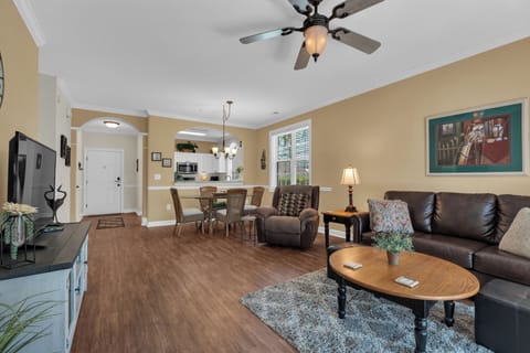 Luxury vinyl plank flooring in entire unit. Living Room with pullout couch.