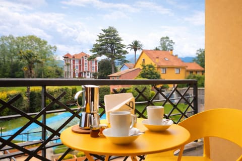 Property building,Balcony/Terrace,Garden view,Pool view,Swimming pool