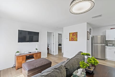 Cozy Great room-style living space connects kitchen, dining, and living rooms.