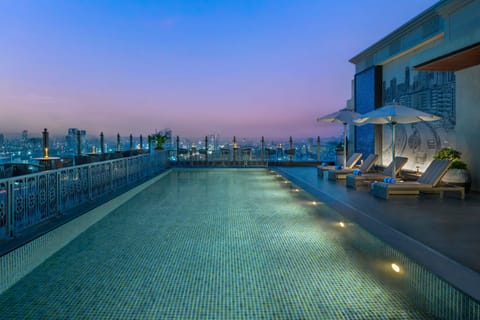 Outdoor pool, pool umbrellas, sun loungers