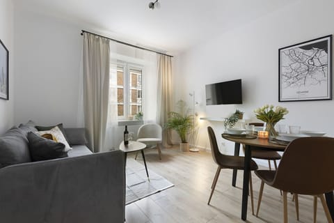 Classic Apartment, City View | Living area | Flat-screen TV