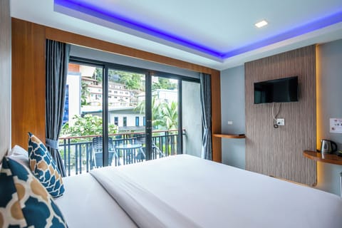 Deluxe Room, Pool View | Minibar, in-room safe, free WiFi