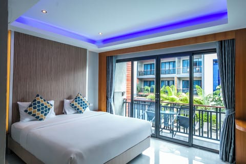 Deluxe Room, Pool View | Minibar, in-room safe, free WiFi