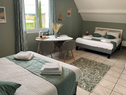 Family Quadruple Room, Garden View | Free minibar items, desk, laptop workspace, free WiFi