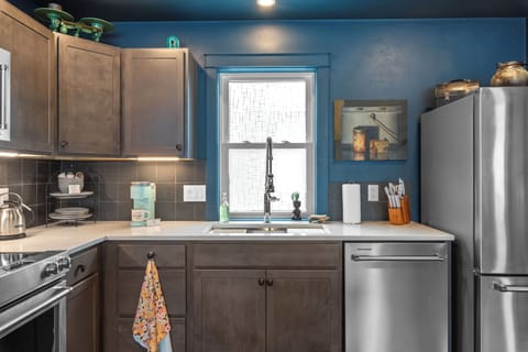 Another view of the fully equipped kitchen workspace.