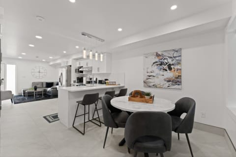 Sleek dining table paired with sculptural chairs