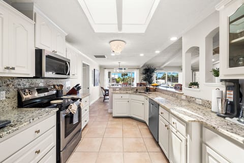 Your perfect getaway starts here, where cooking becomes a joy in a kitchen designed for both form and function.