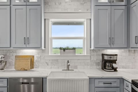 Do dishes with a view—farm scenery right from the kitchen sink at Captain’s Quarters in Galveston, TX.