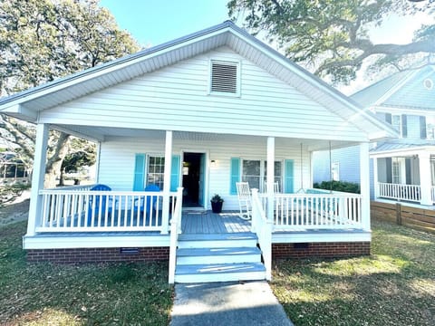 Comfortable front porch w/rocking chairs and swinging chairs. Perfect place to relax.