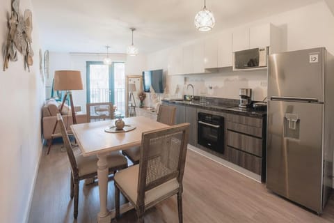 Open-plan dining and kitchen area with modern appliances