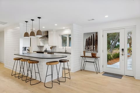 Step through the grand entrance - As you step through the grand entrance, floor-to-ceiling sliding glass windows draw your gaze, wrapping around the home to reveal a mesmerizing panorama