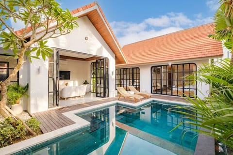 Experience pure relaxation in our living room with pool views. Sink into our comfy sun loungers and let serenity wash over you