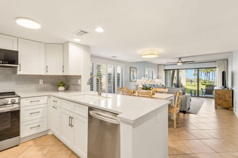 Fully Stocked Kitchen Opens to Living and Dining Area