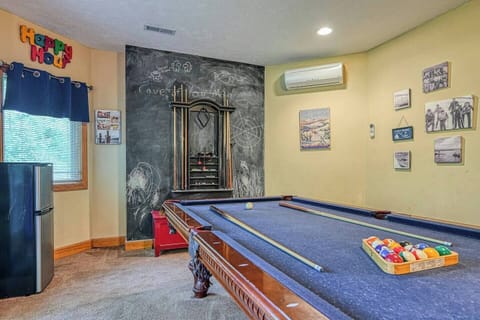 Gameroom view from couch.   Pool table and chalk board to keep score.