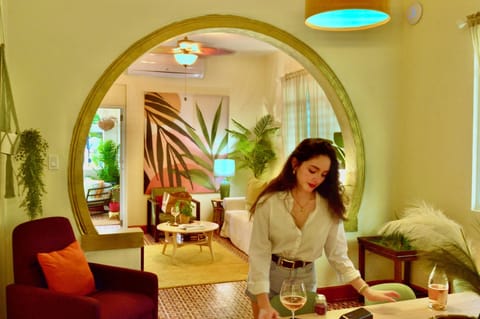 Signature Apartment, Balcony, Ground Floor | Living area | 55-inch flat-screen TV with cable channels