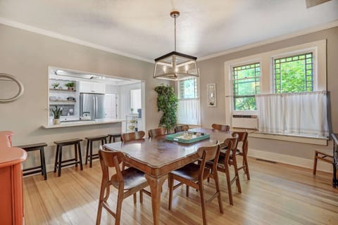 Dinner party ready: A classic dining room with a long table and elegant chandelier sets the stage for memorable meals.