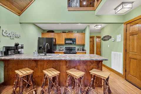 Four dining stools at the eat in kitchen