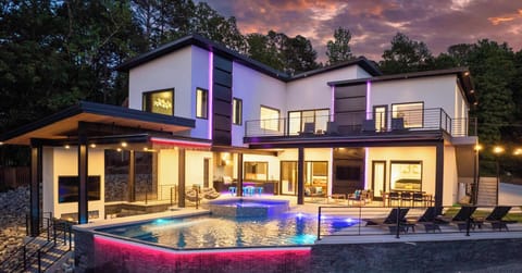 Your VIP oasis awaits. Dive into the infinity-edge pool, unwind in the hot tub, or catch the game on one of the 2 outdoor TVs. This is luxury living at its finest