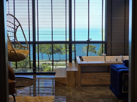 Premium Suite, Balcony, Sea View | Premium bedding, in-room safe, individually decorated, desk