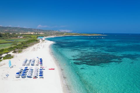 Private beach, white sand, sun loungers, beach umbrellas