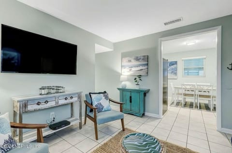 Living room with large smart TV.