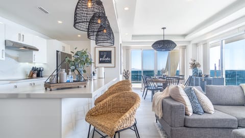 the bar stools at the kitchen counter make a great spot for a casual breakfast