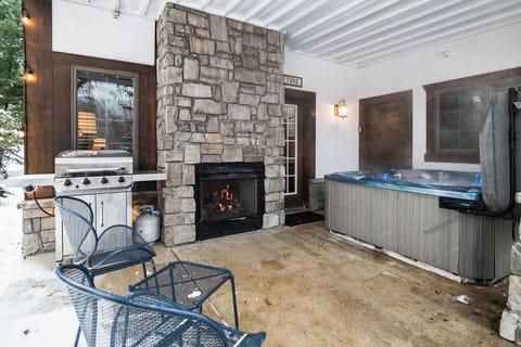 Hot tub, cozy fireplace and grill on the patio!