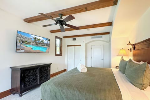 Lounge beneath the gentle breeze of the ceiling fan as you cozy up in the embrace of a king-sized bed.
