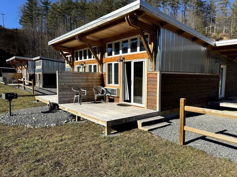 Custom-built, modern duplex structure with porch.