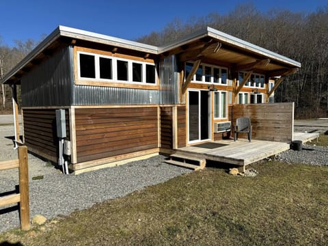 Custom-built, modern duplex structure with porch. 