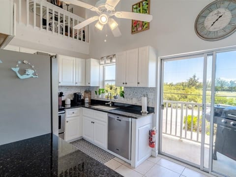 Your fully equipped kitchen and a grill out the balcony.