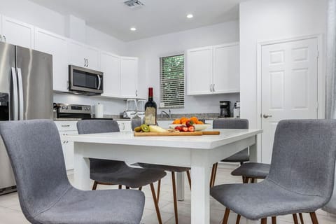 Open plan living area and well equipped kitchen, with toaster, coffee maker, Keurig, coffee grinder, and all the major appliances.