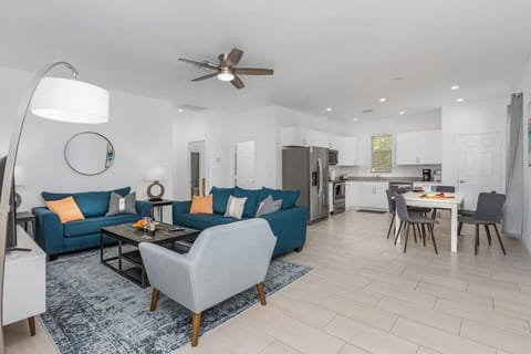 Open plan living area and well equipped kitchen, with toaster, coffee maker, keurig, coffee grinder, and all the major appliances.