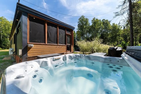 Unwind in the hot tub while taking in the mountain scenery.