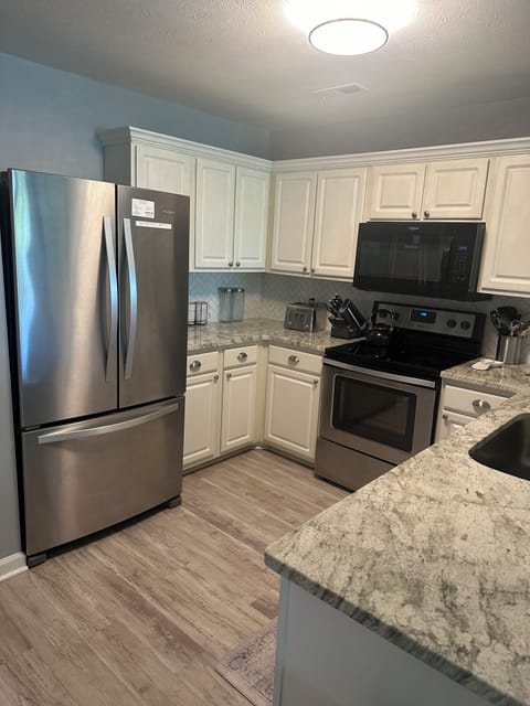 Upgraded kitchen with granite counter tops.