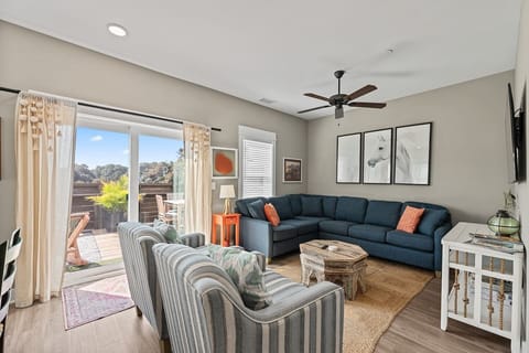 Gather together in this bright and comfortable living room.