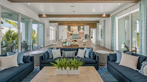 Great Room - Open Floor Plan - Fully Stocked Kitchen, Dining and Bar seating - Balcony Access