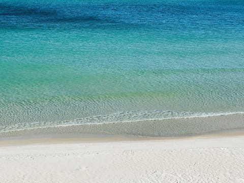 Beautiful white sand private beach with emerald waters 