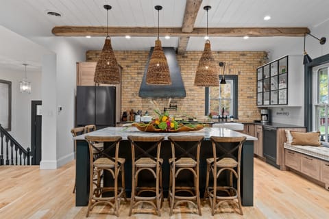 Dreamy modern farmhouse kitchen w/ warm textures & open sightlines.