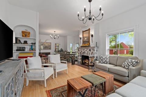 Open-concept living & dining area filled w/ natural light and easy flow for gathering.