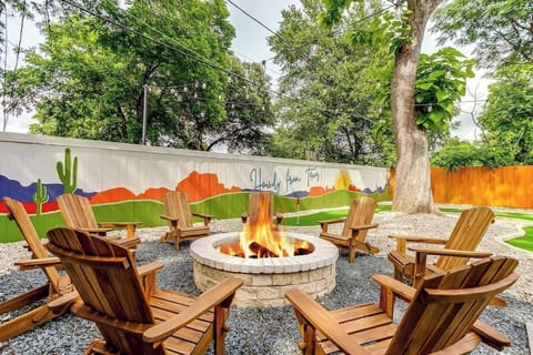 Gather around the fire pit in the backyard for cozy nights under the stars. Perfect for roasting marshmallows, enjoying conversation, or relaxing in the comfortable Adirondack chairs. It's a great place to unwind and enjoy great company.