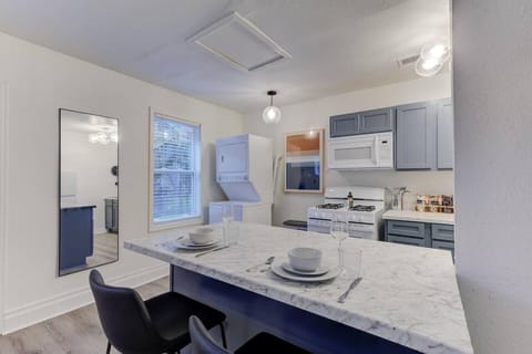 Enjoy easy mornings in this modern, full kitchen—perfect for a cozy breakfast or evening snack.