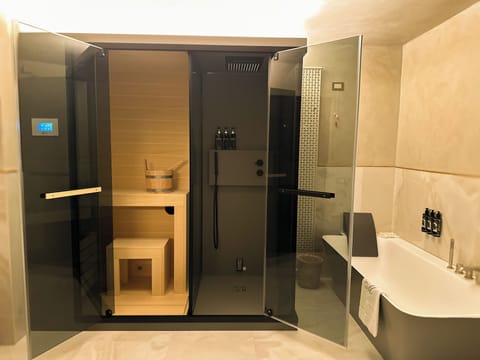 Suite, Garden View | Bathroom | Separate tub and shower, rainfall showerhead, free toiletries